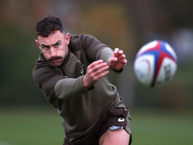 TEDDINGTON, ENGLAND - NOVEMBER 09: Nic White passes the ball during an Australia Rugby Training Session ahead of their International Match against England. At The Lensbury on November 09, 2021 in Teddington, England. (Photo by Alex Pantling/Getty Images)