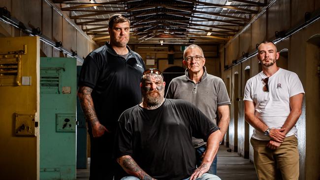 Former Finks MC members Matt and Tyson Ward (sitting), Henry Keogh and Arcofyre Founder and CEO Kirby Brownlow at the old Adelaide Jail. Picture Matt Turner.