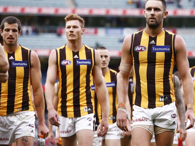 Hawks players look dejected after the Round 7 AFL match between the Melbourne Demons and the Hawthorn Hawks at the MGC in Melbourne, Saturday, May 4, 2019.  (AAP Image/Daniel Pockett) NO ARCHIVING, EDITORIAL USE ONLY