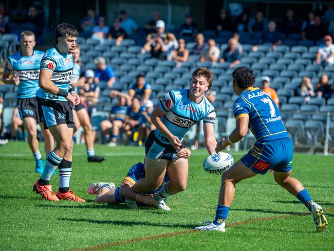 Alex Challenor looks to offload. Picture Thomas Lisson