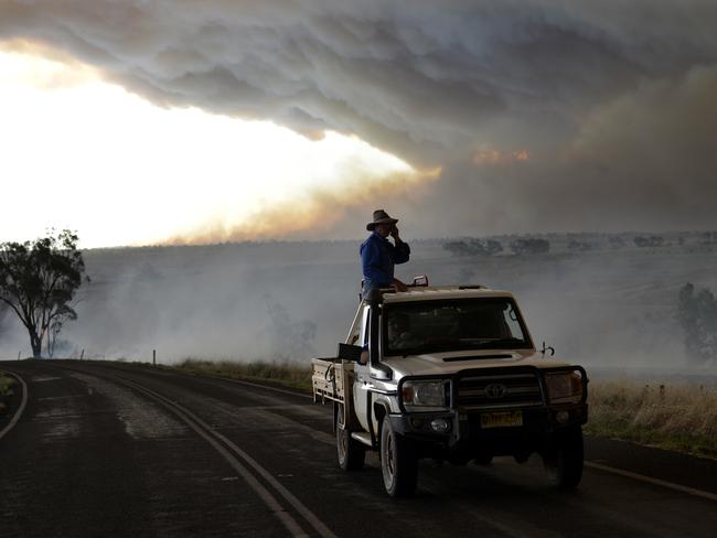 A wall of smoke can be seen in the background between Merriwa and Cassilis in the central west. Picture: Jeremy Piper