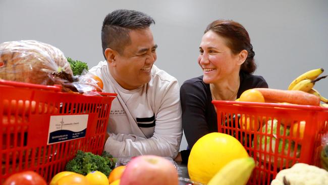 Kings Park food relief service Hands and Feet provides a hampers of hope to some of Sydney’s most disadvantaged people. Pictured, Kings Park Community Church pastor Ariel Cinco and Hands and Feet volunteer Marilyn Brown. Picture: Angelo Velardo