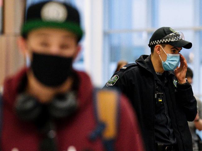 Police presence at arrivals in Adelaide Airport after SA announces a border closure to NT, WA, QLD and the ACT in Adelaide/ Kaurna, Sunday, 27 June, 2021. (The Advertiser/ Morgan Sette)