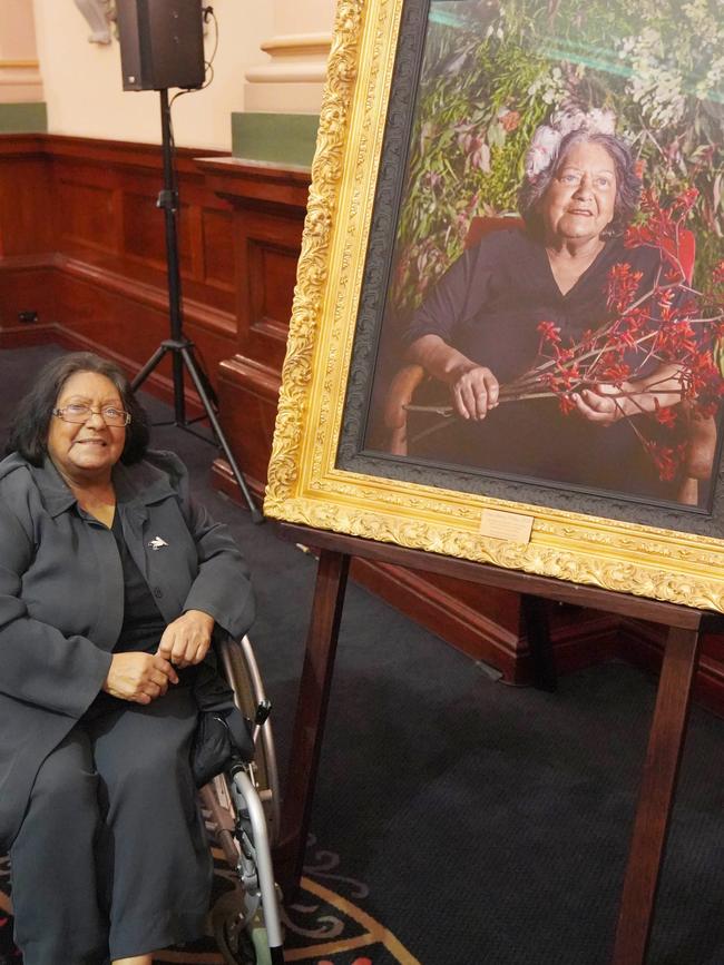 Aunty Shirley Peisley AM with her portrait by artist Dr Ali Gumillya Baker that is now on display in Adelaide Town Hall. Picture: Supplied