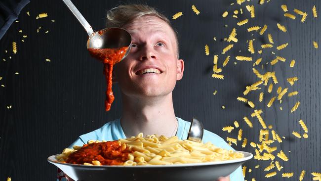 DIG IN: Team Katusha-Alpecin cyclist Mads Wurtz Schmidt with pasta at the Hilton Adelaide. Picture: TAIT SCHMAAL