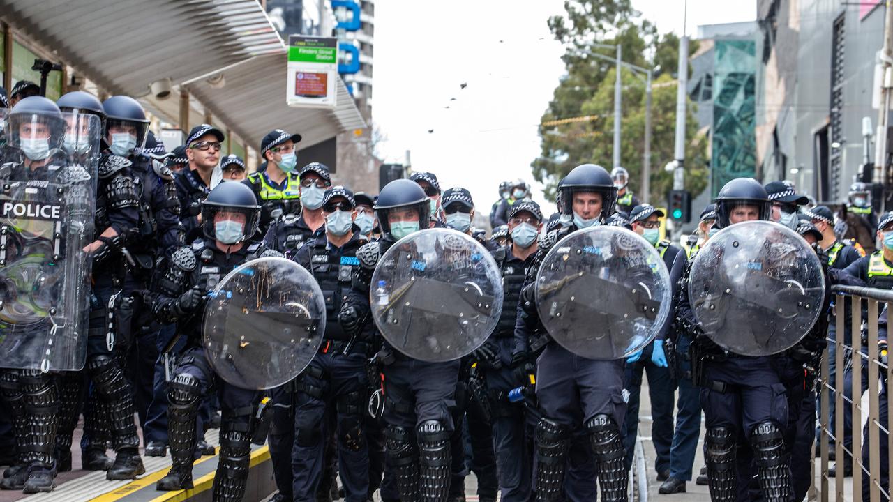 Police fend off Freedom rally protesters in the CBD. Picture: NCA NewsWire/Sarah Matray