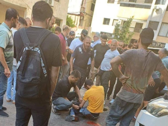 Lebanese men injured after pager attack.