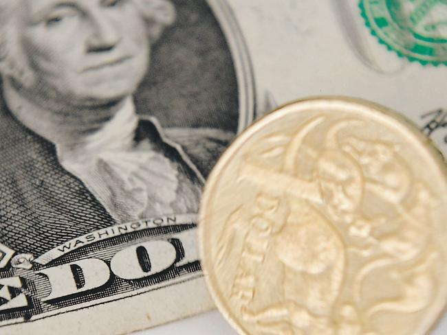 A 1 Australian Dollar coin and a 1 US Dollar note are seen in Canberra, Tuesday, May 21, 2013. As the US economy rebounds, there are predictions that the Australian dollar could fall as low as 90 US cents in the coming weeks and months. (AAP Image/Lukas Coch) NO ARCHIVING