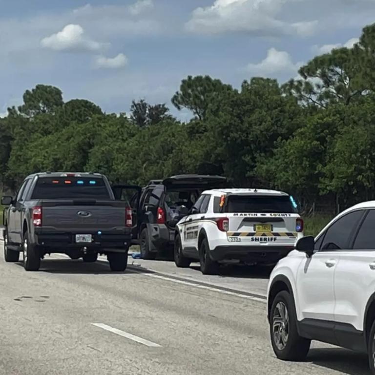 A car believed to be the getaway vehicle is seen on the side of the highway after the driver was pulled over by police. Picture: Martin County Sheriff