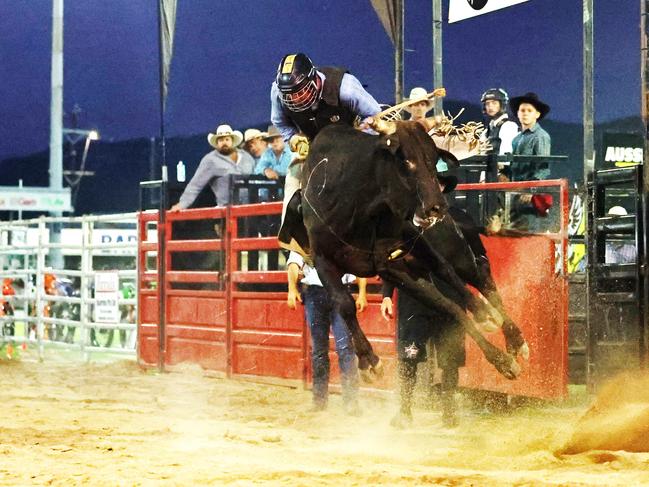 Jake McManus competes in the novice bull ride at the 2024 Cairns Bull Throttle event, a bikes and bulls show, featuring bull riding and freestyle motocross riders at the Cairns Showgrounds. Picture: Brendan Radke