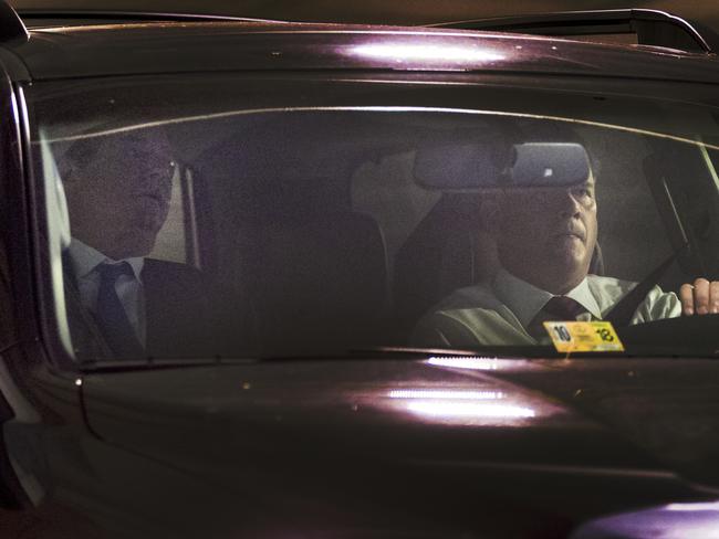 Former Trump Campaign Chairman Paul Manafort, left, leaves his home in Alexandria, Va., Monday, Oct. 30, 2017, in Washington. (AP Photo/Andrew Harnik)