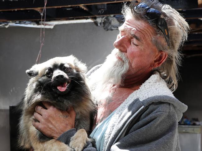 George Rudonski, 58, was saved by his Pomeranian Gucci from a house fire last night at their home on Dargie Place in Eagle Vale. Around 11pm last night, firefighters attended a property in Eagle Vale after reports of a fire. The property was found severely damaged and the homeowner escaped almost unscathed, hospitalised for smoke inhalation. The man's little pomeranian saved his life by alerting him to the fire. Picture: Jonathan Ng