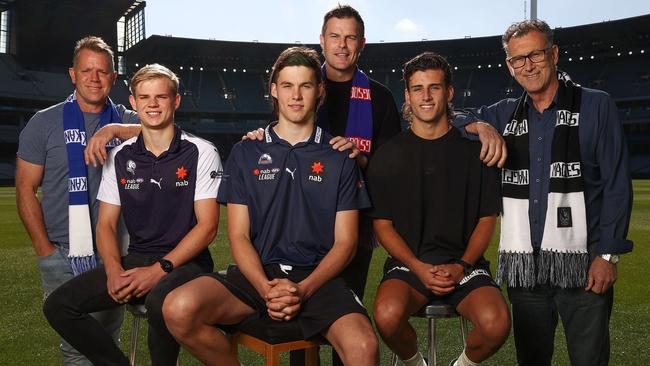 Father-son draft prospects Jackson Archer (with dad Glenn), Sam Darcy (with Luke) and Nick Daicos (with Peter) at the MCG. Picture: Michael Klein