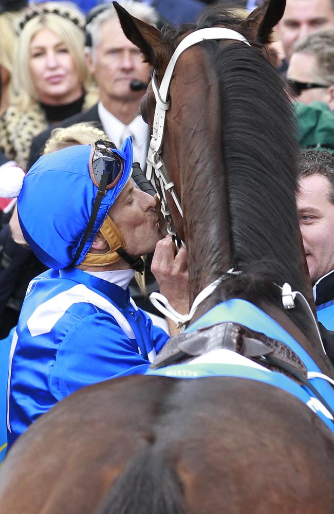 Jockey Hugh Bowman plants a kiss on Winx in the winner’s enclosure at the Valley last year. Picture: David Crosling