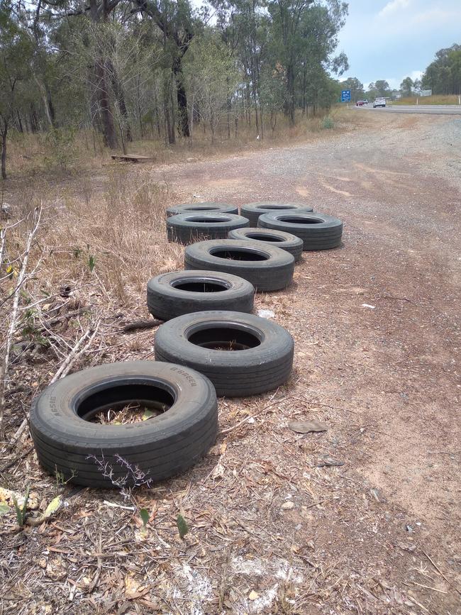 Tyres that have allegedly been illegally dumped alongside the Bruce Highway near St Lawrence. Picture: Lance Payne