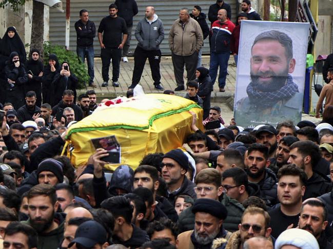 UPSIZED VERSION Mourners carry the coffins of a Hezbollah fighter and of one of his relatives who were killed in Israeli bombardment the previous night, during a funeral procession in Bint Jbeil, in southern Lebanon near the border with Israel, on December 27, 2023, amid ongoing cross-border tensions as fighting continues between Israel and Hamas militants in Gaza. An Israeli air strike on a south Lebanon border town killed a Hezbollah fighter, the group said on December 27, with state media reporting two of his relatives were also killed. (Photo by AFP)