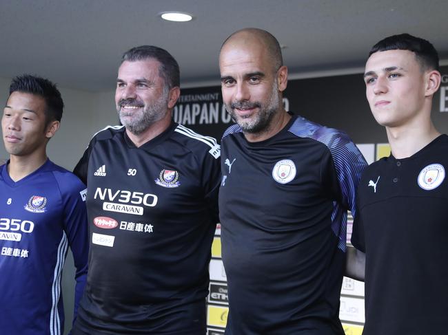 Manchester City manager Pep Guardiola, second from right, J-League's Yokohama Marinos head coach Ange Postecoglou, second from left, Marinos player Takuya Kida, left, and Manchester City's player Phil Foden, ahead of last week’s friendly. Pic: AP Photo