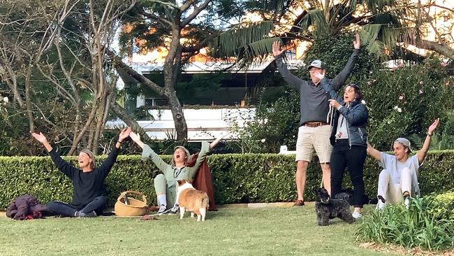 Visitors to the apartment grounds join in the singing at Glenhurst Gardens in Darling Point. Picture: John Appleyard