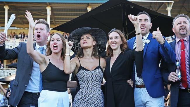 Punters cheer home a winner at Randwick on Saturday.