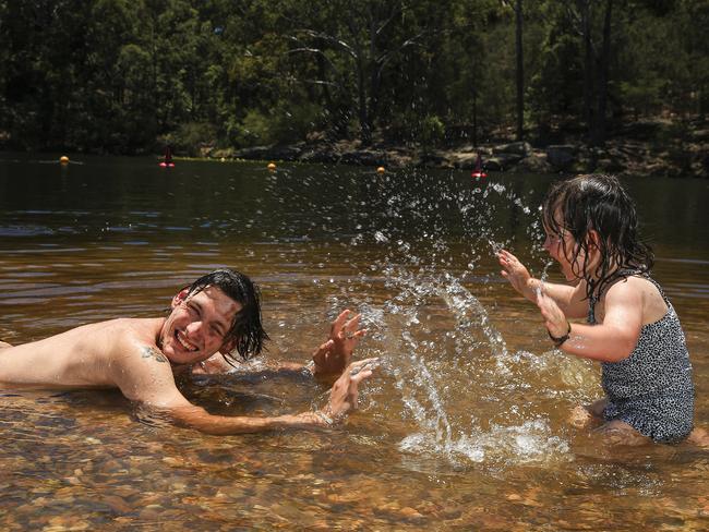 Raymond Hardcastle with his niece Zoey Jennings swimming at Lake Parramatta. Picture: Dylan Robinson