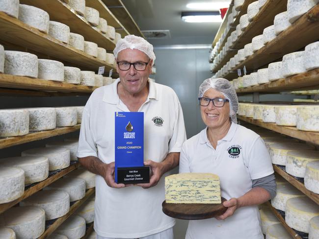 Berrys Creek Cheese owners Barry Charlton and Cheryl Hulls in their cheese storage room with their winning Oak Blue Cheese from the 2020 Grand Dairy Awards. Photo: DANNIKA BONSER