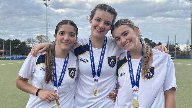 Year 12 Trinity Catholic College state hockey team champions Piper Parker, Lauren McFadden, and Maya Mcgrath.