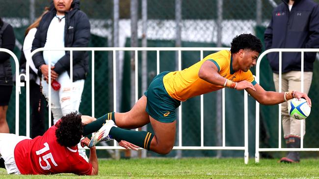 Heamasi Makasini of Australia U18 scores a try during the match between Australia U8s and New Zealand Barbarians at St Paul's Collegiate School. Picture: Getty Images