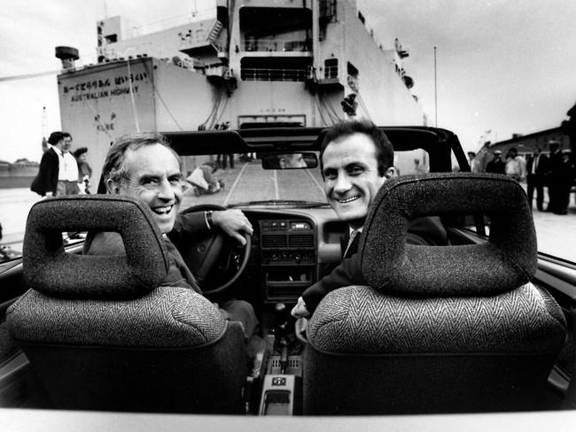 May 1990: Victorian /Premier John Cain (left) and Ford Australia President Jac Nasser drive the first export Ford Capri convertible on to a US-bound cargo ship/ Picture: News Limited