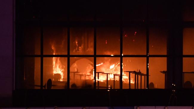 The burning Crocus City Hall following the shooting incident in Krasnogorsk, outside Moscow, on March 22, 2024. The assault is the strongest evidence yet that the Islamist terror threat the US and its allies went into Afghanistan - and then parts of Iraq and Syria - to destroy is back with a vengeance. Picture: AFP