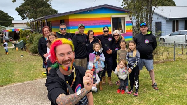 The community helped Mykey O'Halloran paint his Phillip Island house rainbow. Picture: Supplied