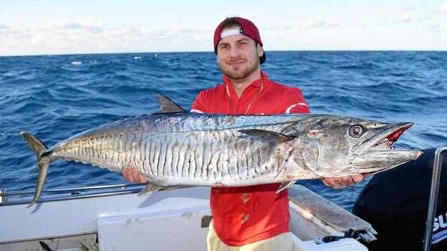 WHAT A CATCH! Jake Day with his "catch of a lifetime" Spanish mackerel that he landed between Rainbow Beach and Fraser Island. Picture: Contributed