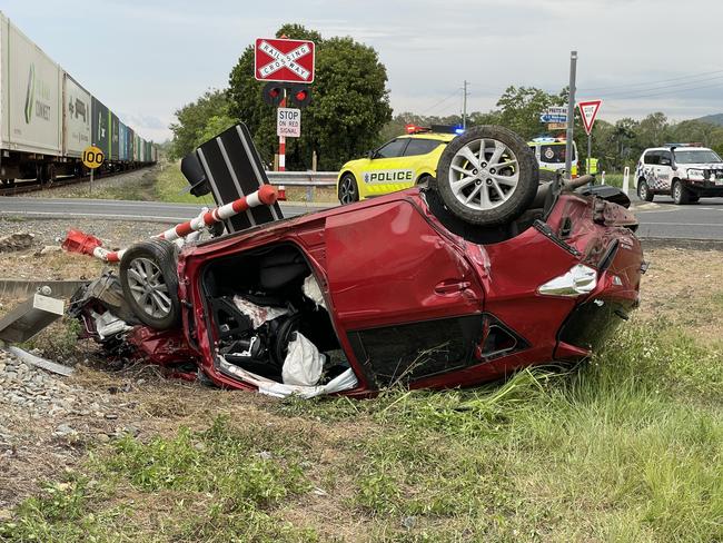 An elderly woman was left with life threatening injuries after her car was hit by a train at a level crossing and landed on its roof on Pratts Rd in Calen, Queensland, north of Mackay on November 15, 2024 around 3:20pm. Picture: Paul Brescia