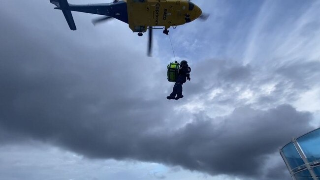 The winch rescue from the cruise liner Pacific Encounter off the Central Queensland coast on October 5, 2022. Photo: RACQ CapRescue.