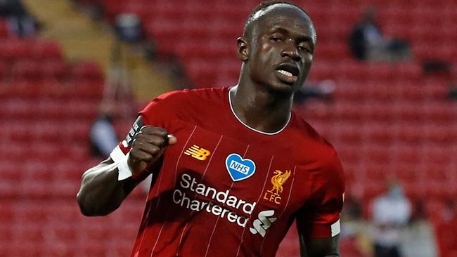 Liverpool's Senegalese striker Sadio Mane celebrates scoring his team's fourth goal during the English Premier League football match between Liverpool and Crystal Palace at Anfield in Liverpool, north west England on June 24, 2020. (Photo by PHIL NOBLE / POOL / AFP) / RESTRICTED TO EDITORIAL USE. No use with unauthorized audio, video, data, fixture lists, club/league logos or 'live' services. Online in-match use limited to 120 images. An additional 40 images may be used in extra time. No video emulation. Social media in-match use limited to 120 images. An additional 40 images may be used in extra time. No use in betting publications, games or single club/league/player publications. /