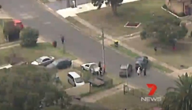 Police surrounded a house with two armoured vehicles after a man was allegedly shot. Picture: 7 News