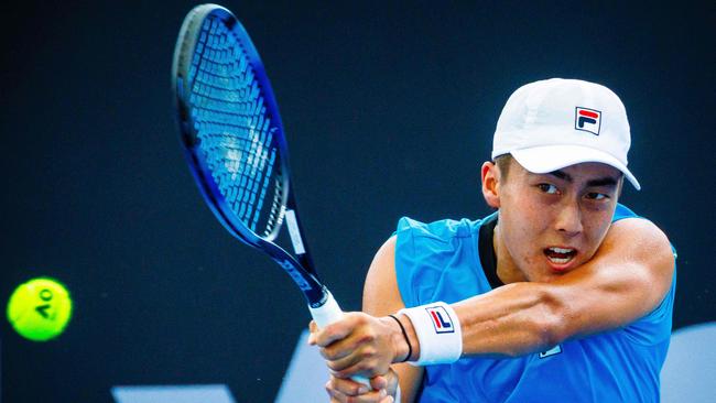 Australia's Rinky Hijikata hits a return against Czech Republic's Tomas Machac during their men's singles match at the Brisbane International. Picture: Patrick Hamilton / AFP.