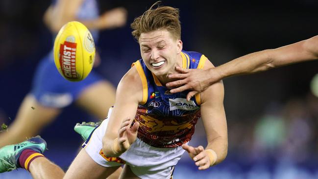 AFL Round 11. 03/06/2018. North Melbourne v Brisbane Lions at Etihad Stadium. Brisbane Lions' Alex Witherden clears by hand. Pic: Michael Klein