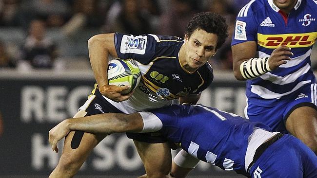 CANBERRA, AUSTRALIA - MARCH 22: Matt Toomua of the Brumbies is tackled during the round six Super Rugby match between the Brumbies and the Stormers at Canberra Stadium on March 22, 2014 in Canberra, Australia. (Photo by Stefan Postles/Getty Images)