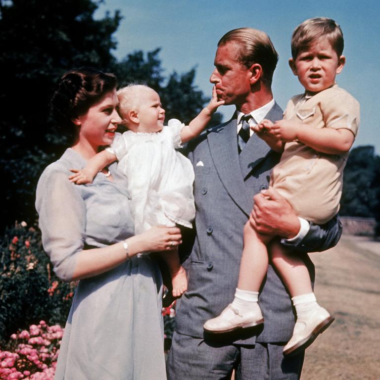 The first color photograph of Princess ANNE, taken in 1951, in the arms of her mother Queen ELIZABETH II while her father, Philip MOUNTBATTEN, holds her brother Prince CHARLES. Picture: Keystone-France/Gamma-Keystone via Getty Images