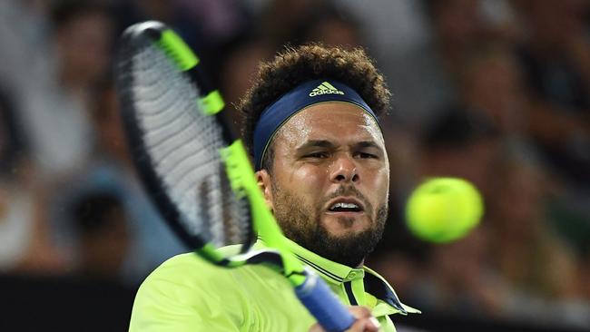 Tsonga fought hard but the Aussie proved too much at Melbourne Park