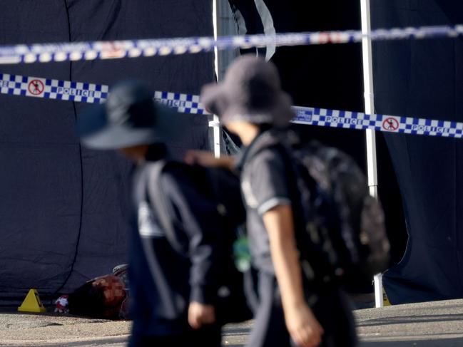 This photo of schoolkids looking on as Stemler’s dead body lay on the streets shocked the community at the time. Picture: NCA NewsWire