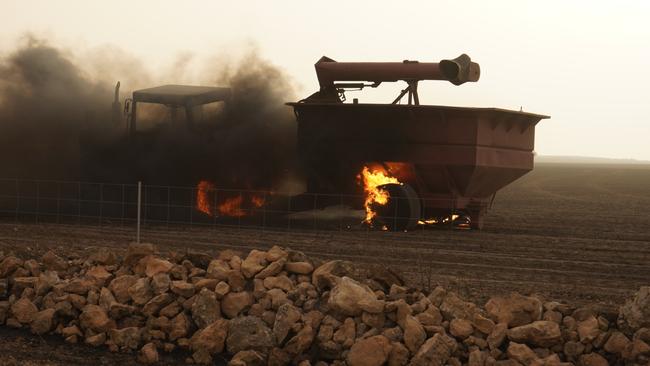 A tractor and trailer alight at the Yorketown bushfire. Picture: Matt Loxton