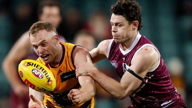 Tom Mitchell and Lachie Neale go at it in Launceston. Picture: Dylan Burns/AFL Photos via Getty Images