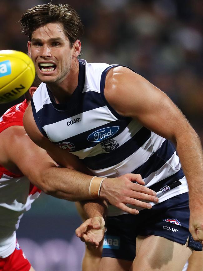 Tom Hawkins clears by hand. Picture: Michael Klein