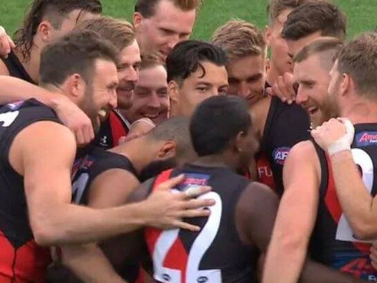 Essendon players crack a joke during their loss to Geelong.