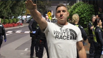 The group were escorted outside the bar by police, with another image surfacing of a man performing the salute in front of a group of officers. Picture: Supplied