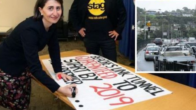 The Premier signing a pledge for the northern beaches tunnel last year.