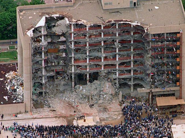 FILE - In this May 5, 1995 file photo, thousands of search and rescue crews attend a memorial service in front of the Alfred P. Murrah Federal Building in Oklahoma City.  More than 600 people were injured in the April 19, 1995 attack and 168 people were killed. Timothy McVeigh was executed in 2001 and Terry Nichols is serving multiple life sentences on federal and state convictions for their convictions in the bombing. (AP Photo/Bill Waugh, FIle)