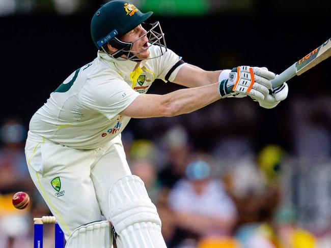 Australia's Steve Smith is struck by South Africa's Kagiso Rabada during day one of the first cricket Test match between Australia and South Africa at the Gabba in Brisbane on December 17, 2022. (Photo by Patrick HAMILTON / AFP) / - IMAGE RESTRICTED TO EDITORIAL USE - STRICTLY NO COMMERCIAL USE-