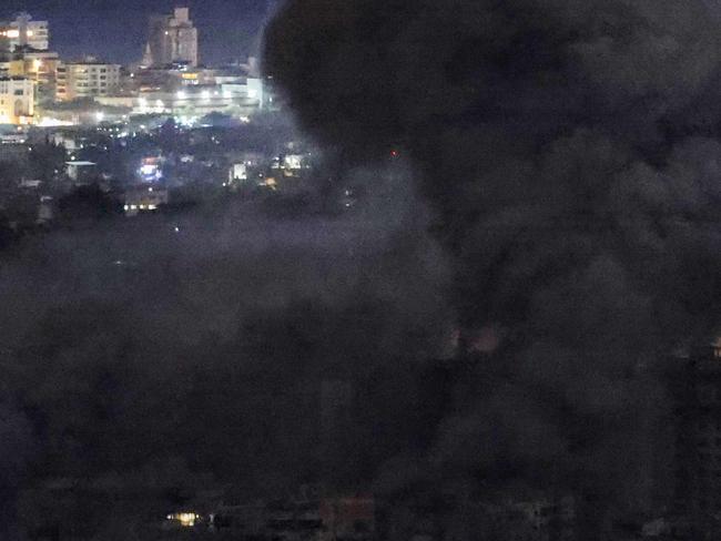 Smoke rises from the site of an Israeli airstrike in the southern suburbs of Beirut early on November 21, 2024, amid the ongoing conflict between Israel and Hezbollah. (Photo by IBRAHIM AMRO / AFP)